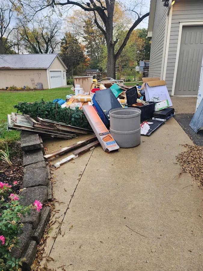 Dumpster being loaded with debris for 30 Yard Dumpster Rental in Valencia West
